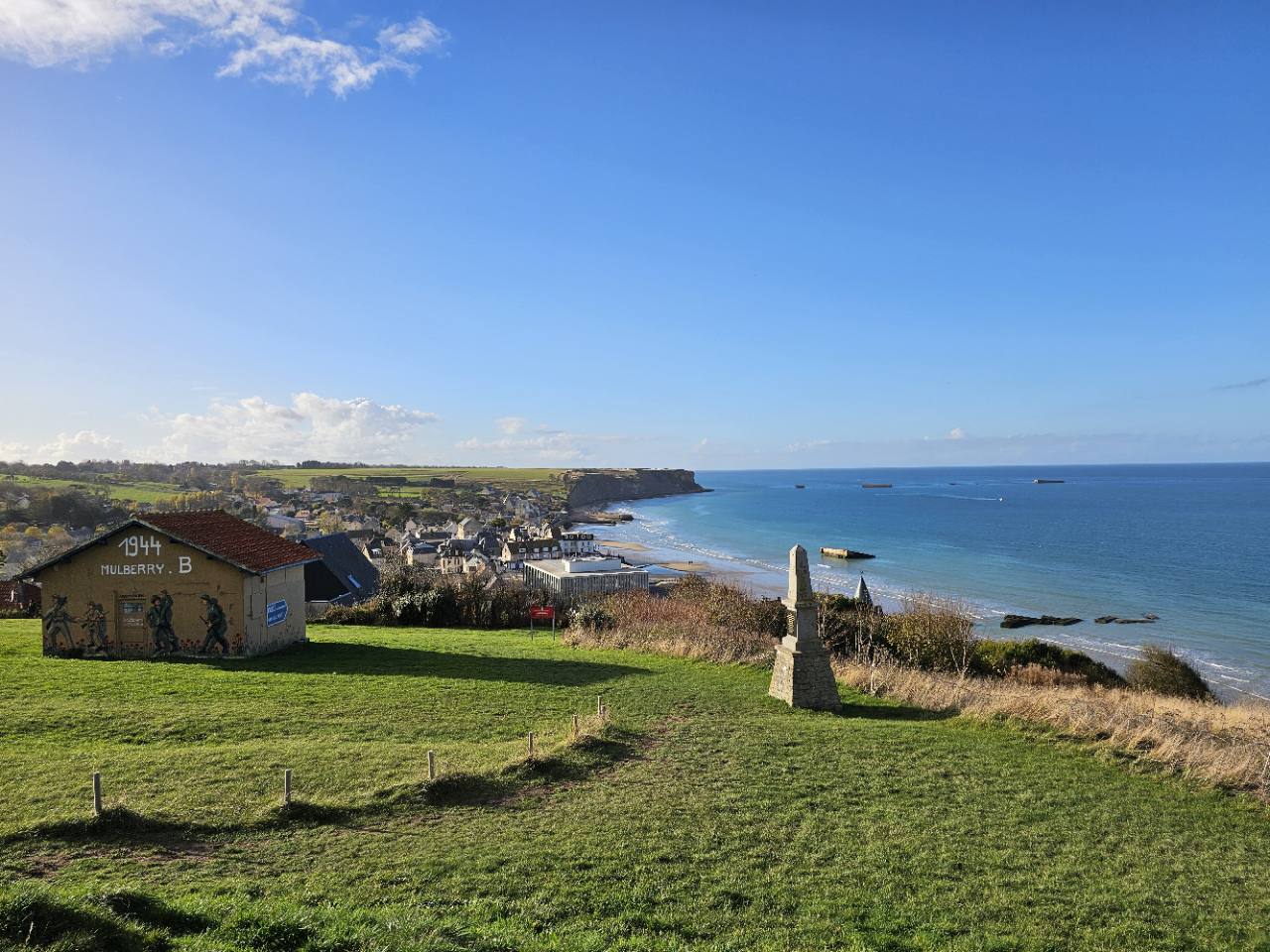 View over Arromanches-les-Bains, the Normandy coast and the remains of the artificial harbour